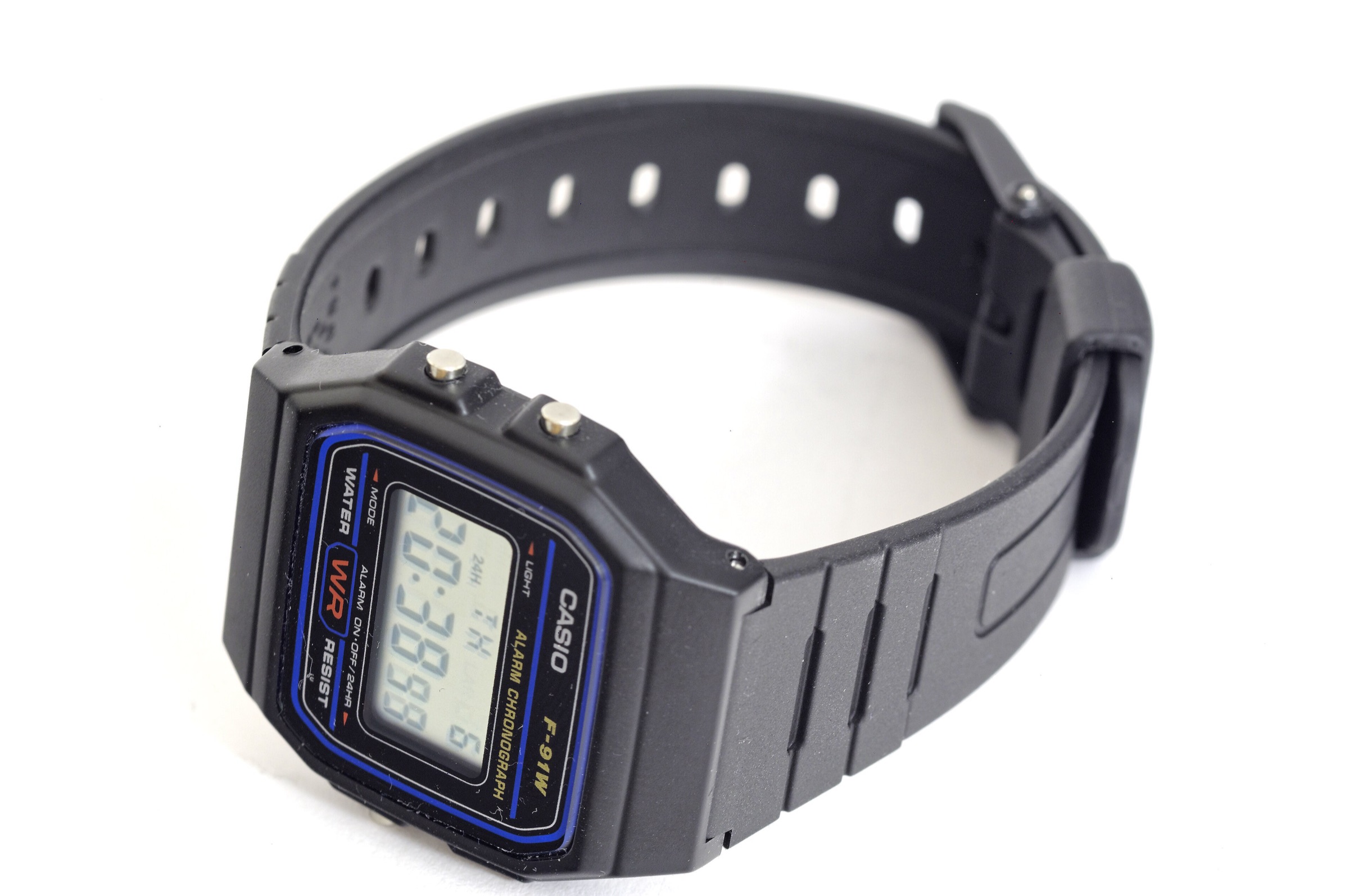 Casio F-91W digital watch on a white background